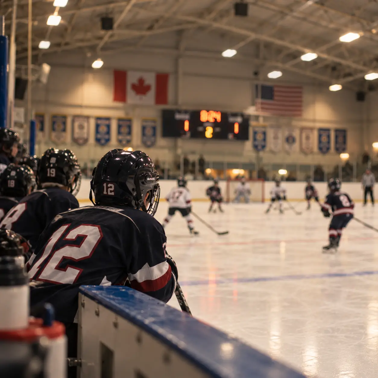 Minor hockey players on the bench watching a game